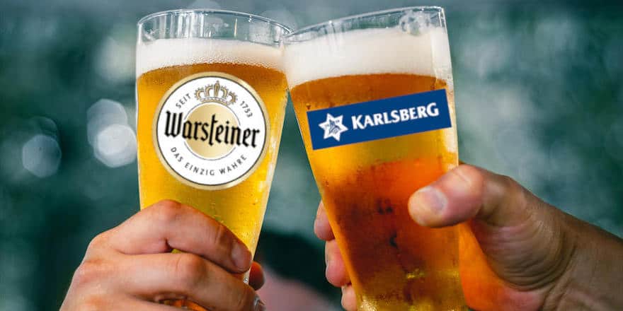 Gläser mit Logos von Warsteiner und Karlsberg stoßen an