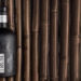 Der Black Rum von Gansloser vor Zuckerrohr-Hintergrund