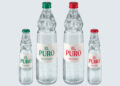 zwei große und zwei kleine Flaschen El Puro